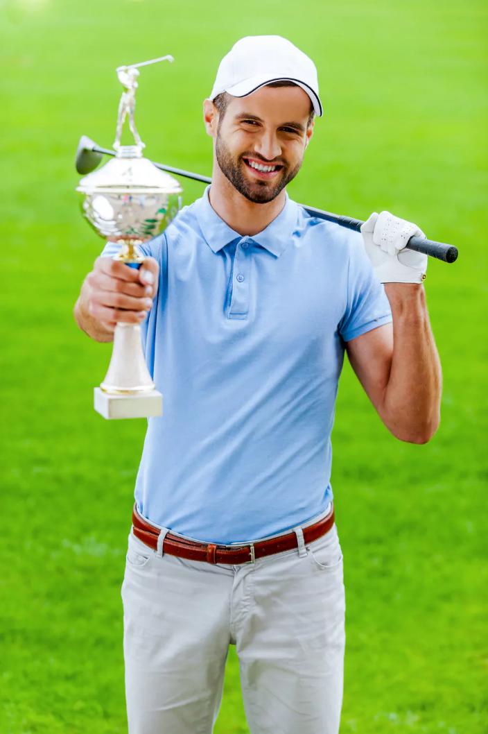 A golfer with a trophy