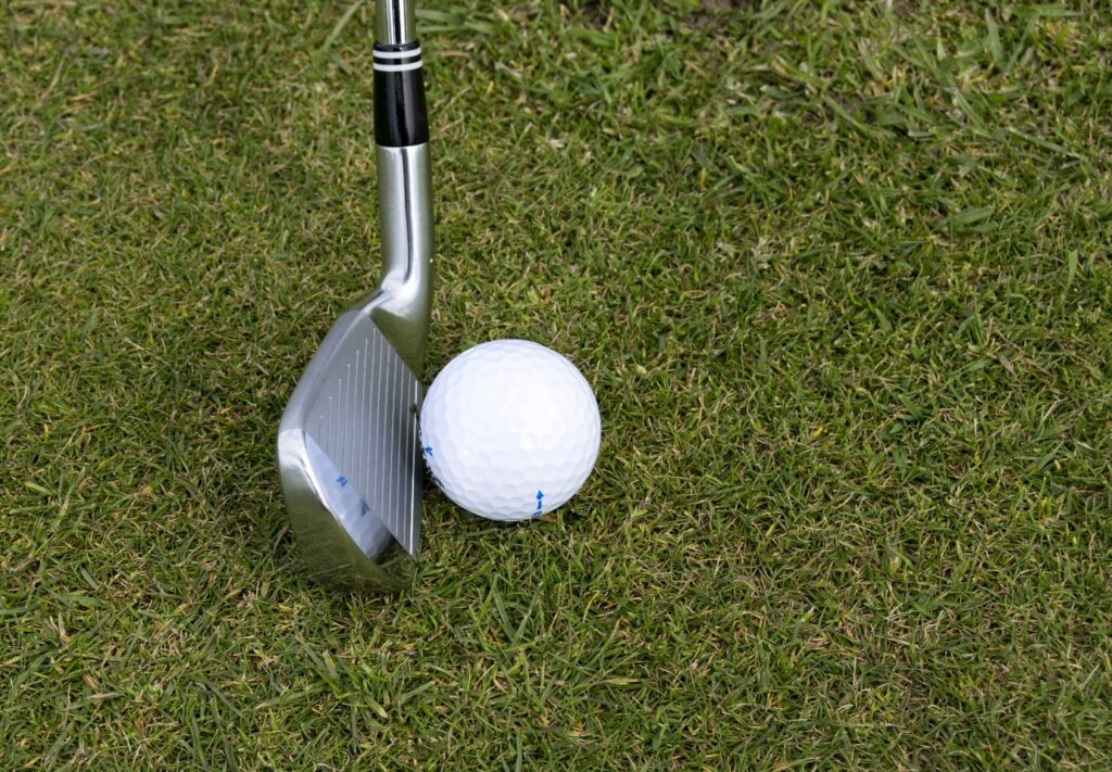A golf ball and a golf club