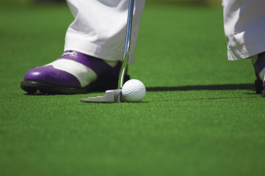 A golf ball and a golf club