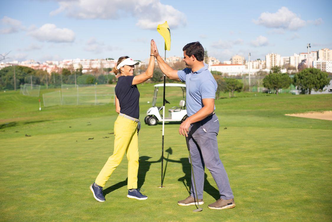 golfers celebrating a shot