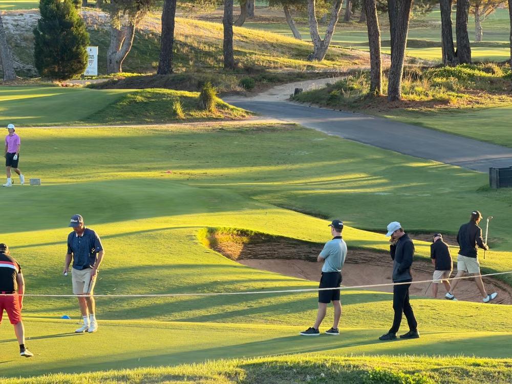 An image of golfers at a golf course