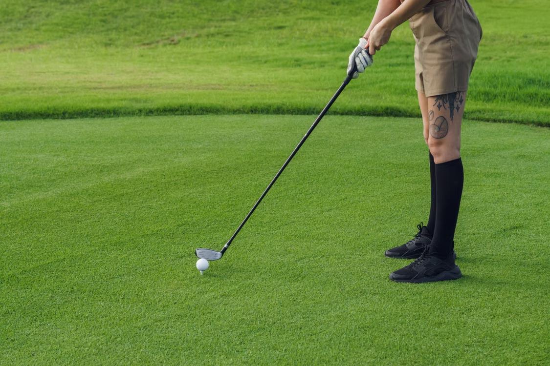 An image of a person playing golf