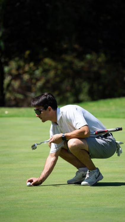 An image of a golfer preparing for a golf shot