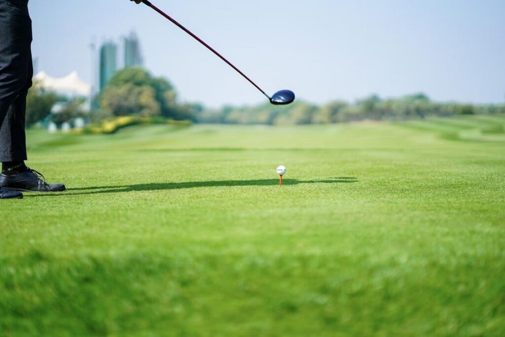 An image of a golf player preparing to hit a ball