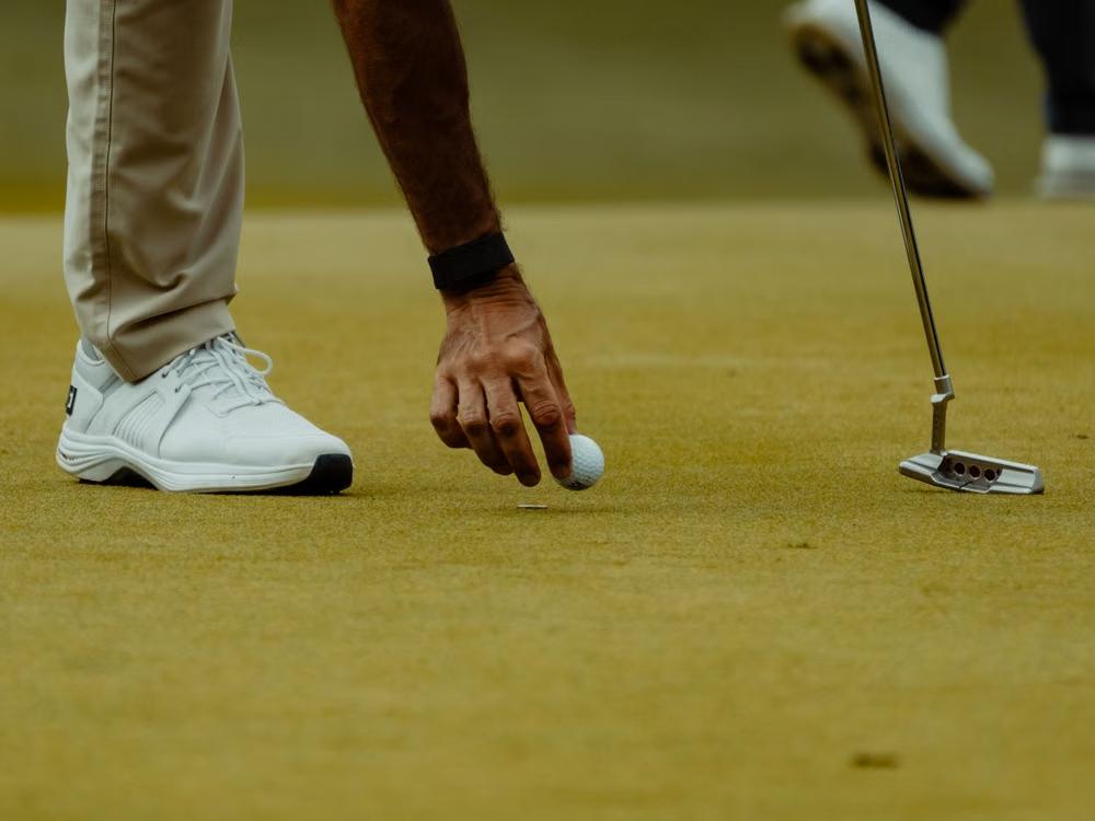 An image of a golfer preparing for a shot
