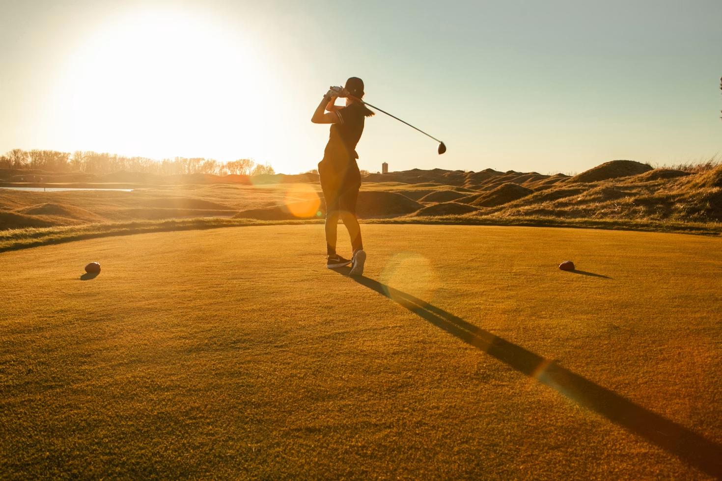 Golfer taking a swing on the course representing an experienced hole-in-one insurance provider for golf tournaments.